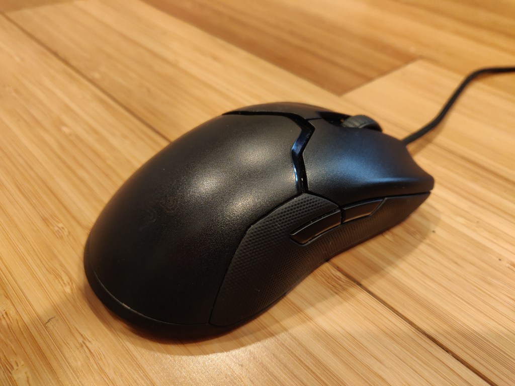 Angled view of Razer Viper on wooden desk.