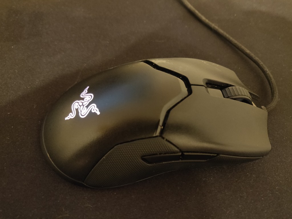 Razer Viper mouse on a deskpad.