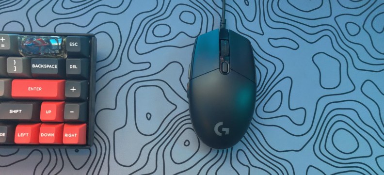 Logitech G203 next to a keyboard
