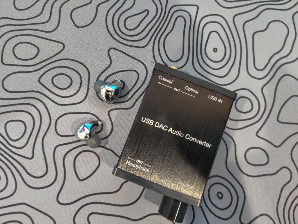 Overhead view of a DAC and some IEMs.