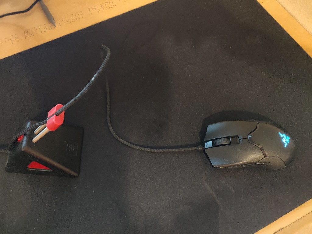 Gaming mouse with a mouse bungee