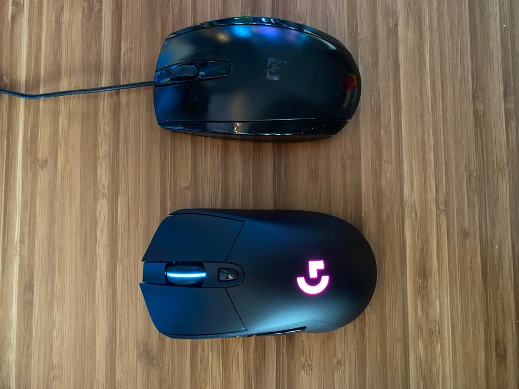 Logitech G703 gaming mouse next to regular mouse.