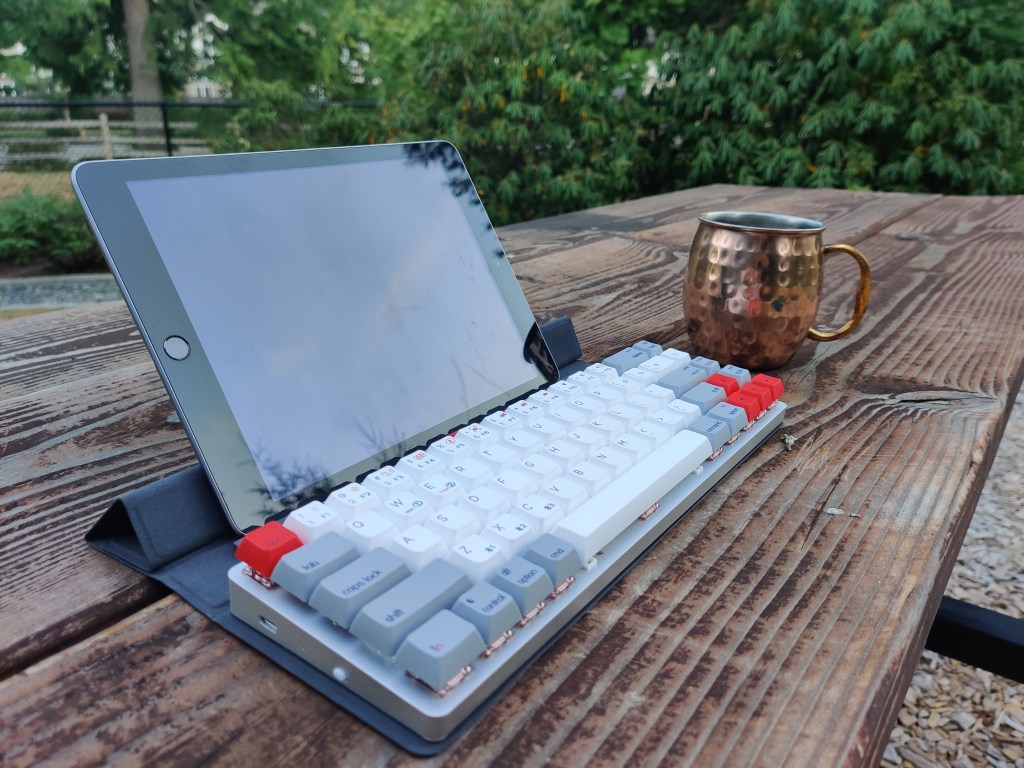 Epomaker NT68 keyboard with an iPad and mug.