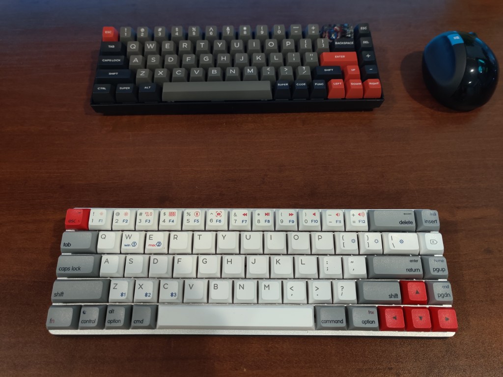 Epomaker NT68 below a Keychron K6 keyboard.