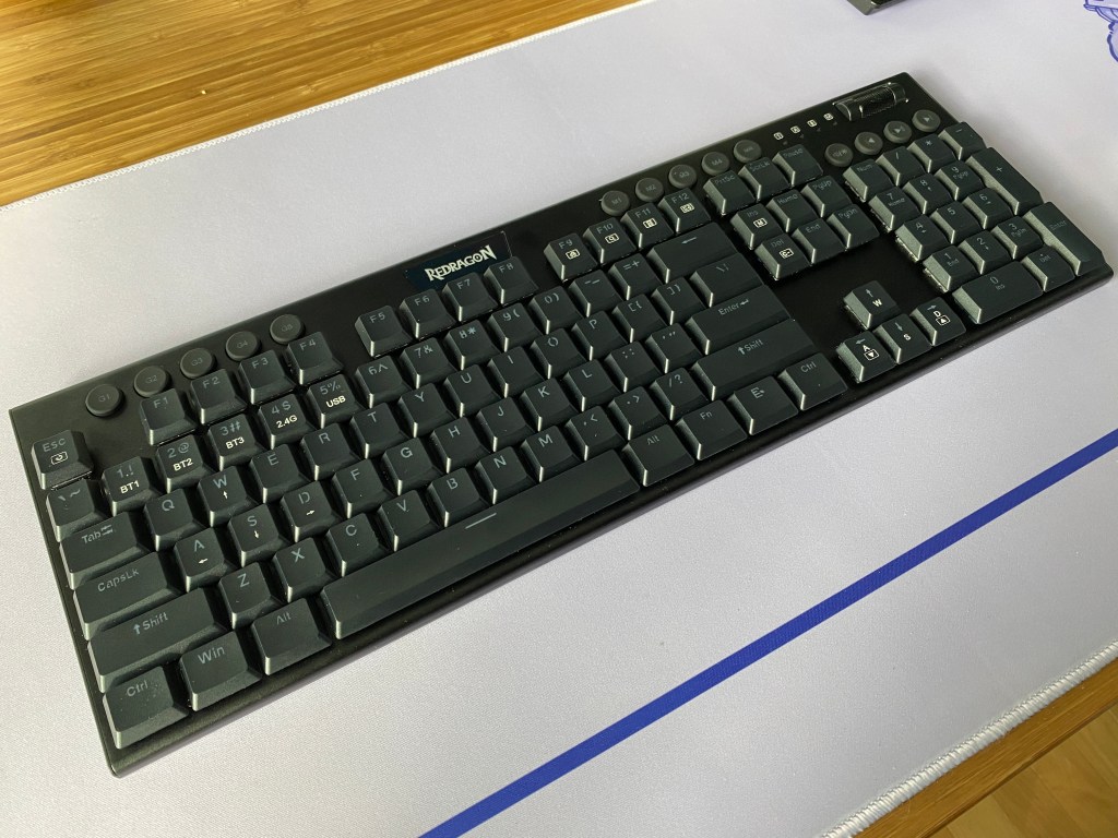 Top view of Redragon Horus K618 mechanical keyboard on desk