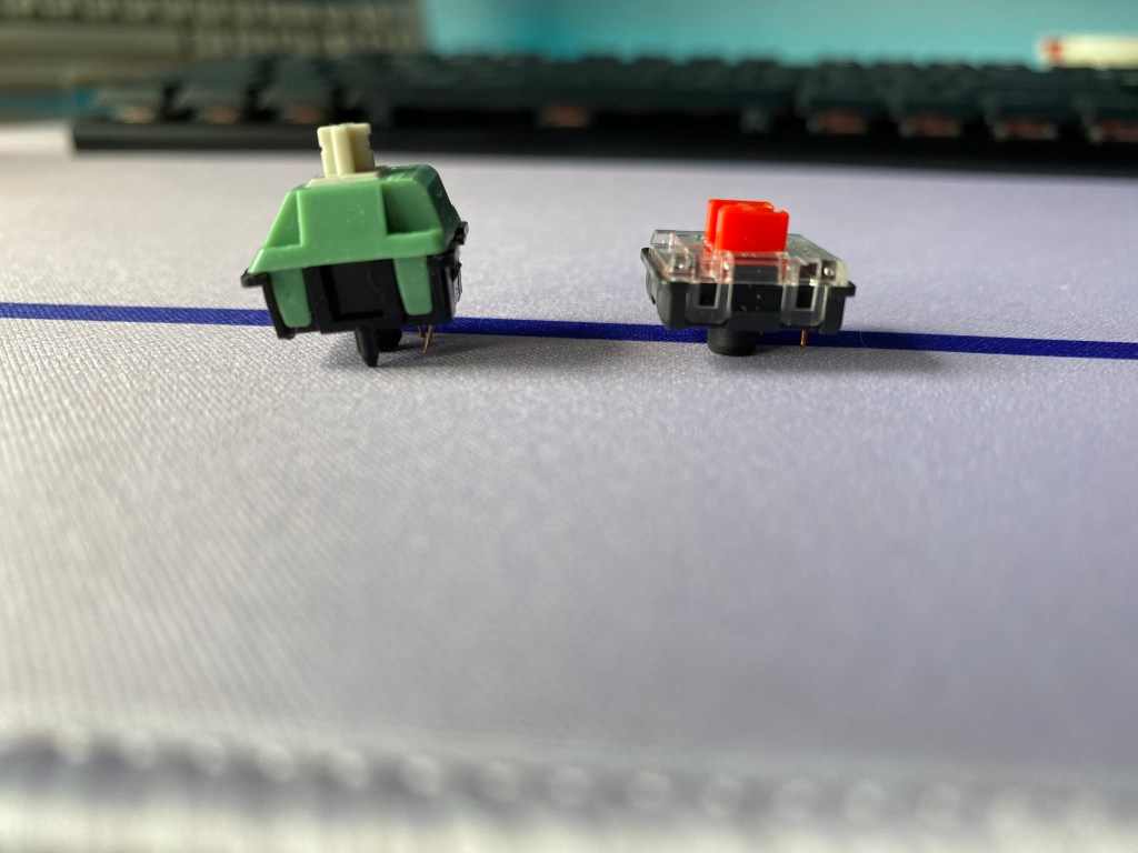 Mechanical keyboard switch next to a low-profile switch