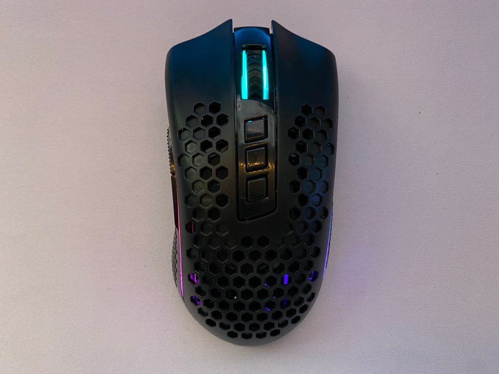 Top view of Redragon M808 Storm Pro mouse on deskpad