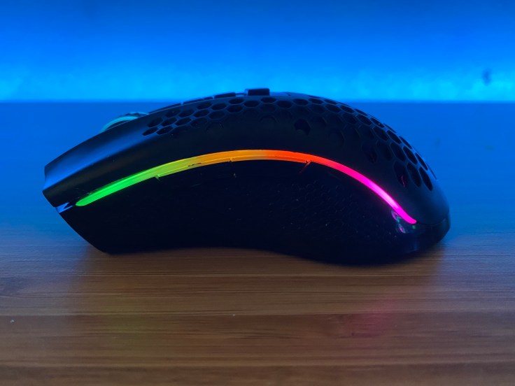 Side view of Redragon M808 Storm Pro mouse on desk